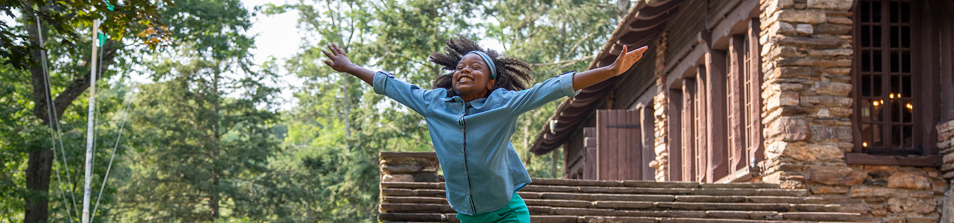  Young Girl Scout running through park 