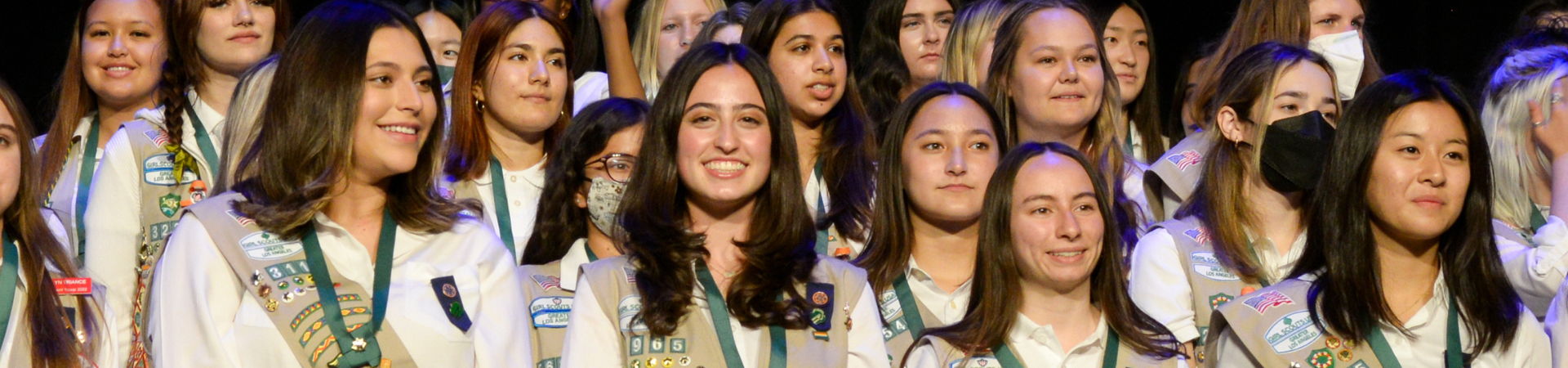  girl scout ambassador high school girl in school wearing sash with highest awards pins 